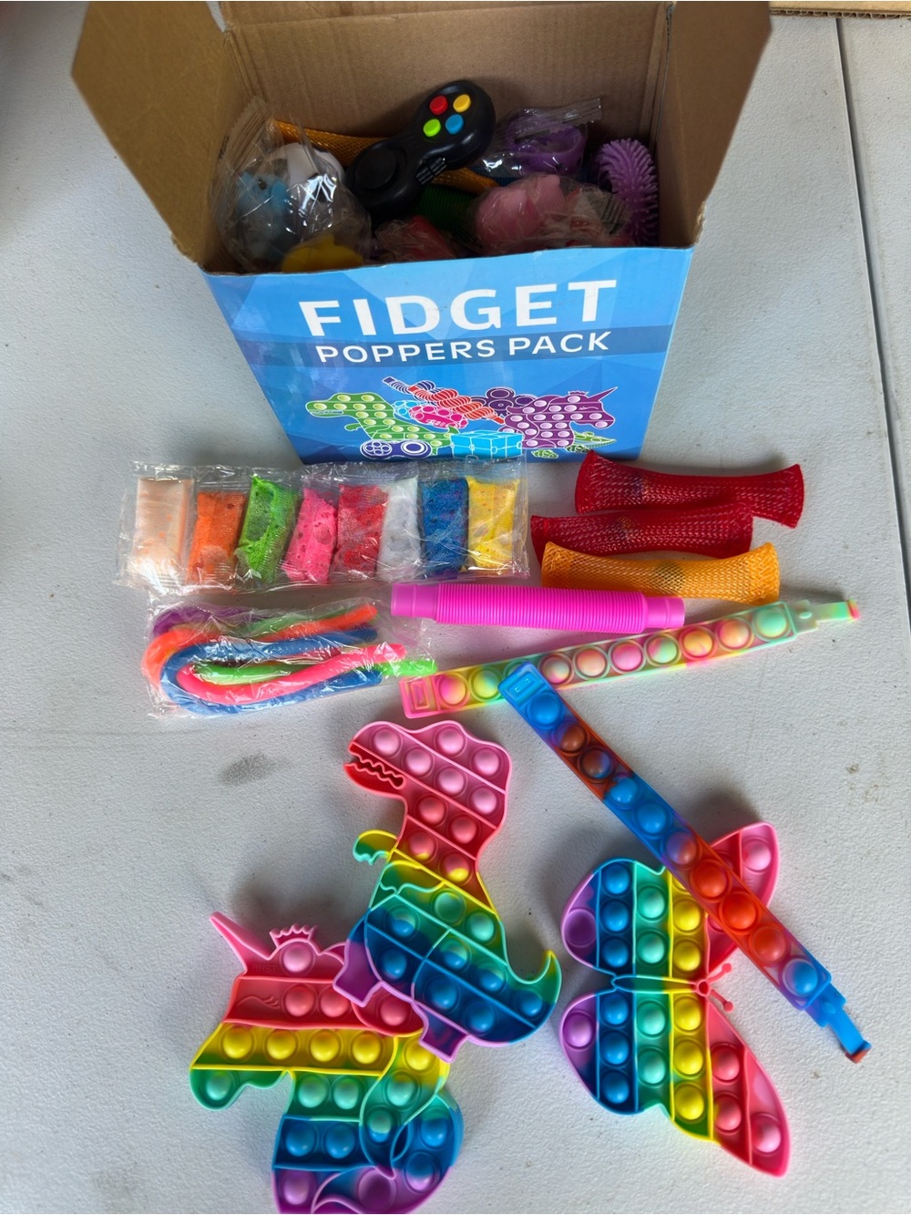 Opened to show contents inside! Rainbow Kids Fidget Toy Pack - Multicolor Popper